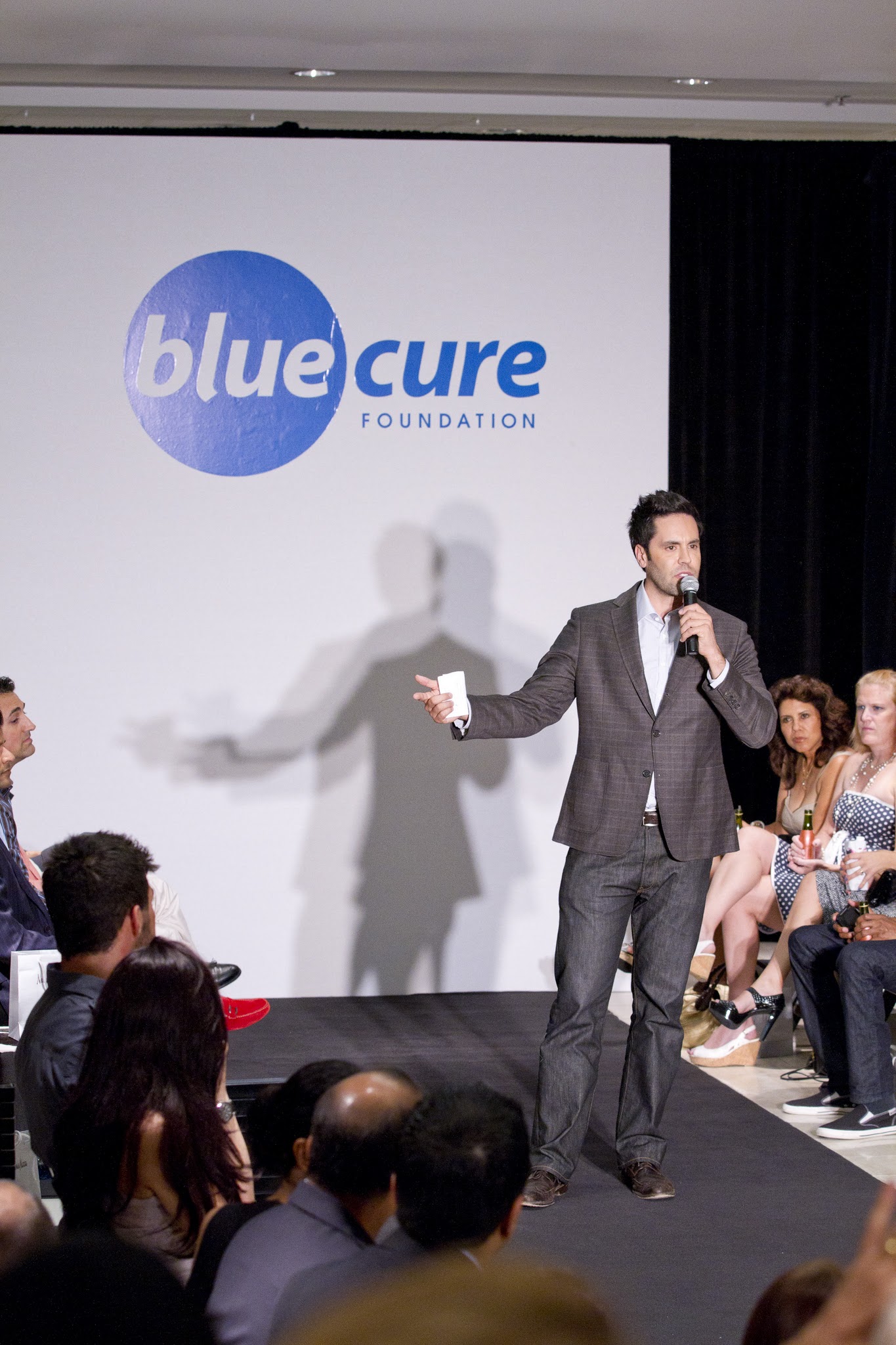 Gabe Canales speaking at Blue Cure event