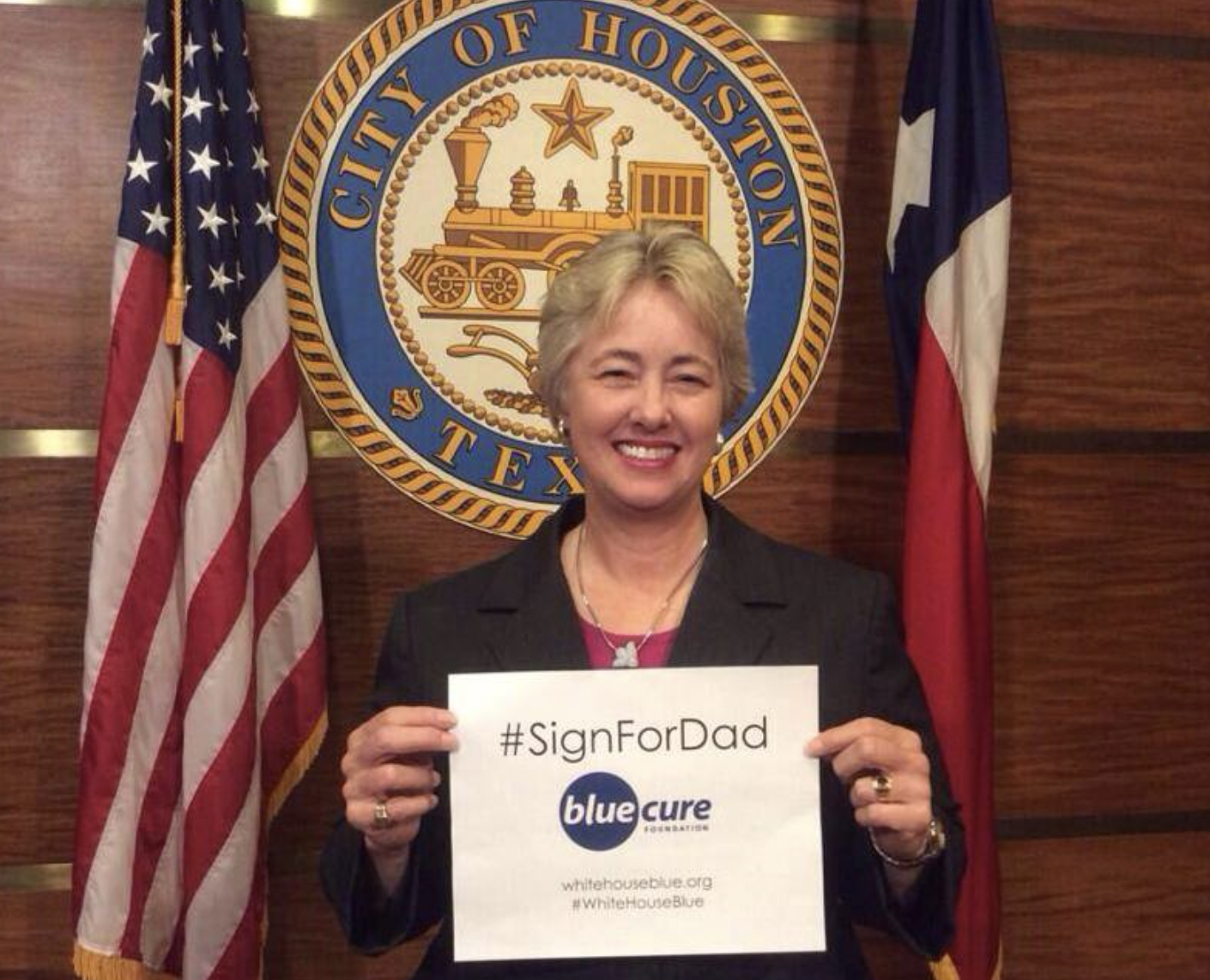 Mayor Annise Parker holds Sign For Dad