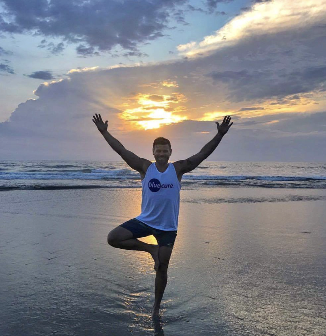 Supporter by ocean with Blue Cure shirt