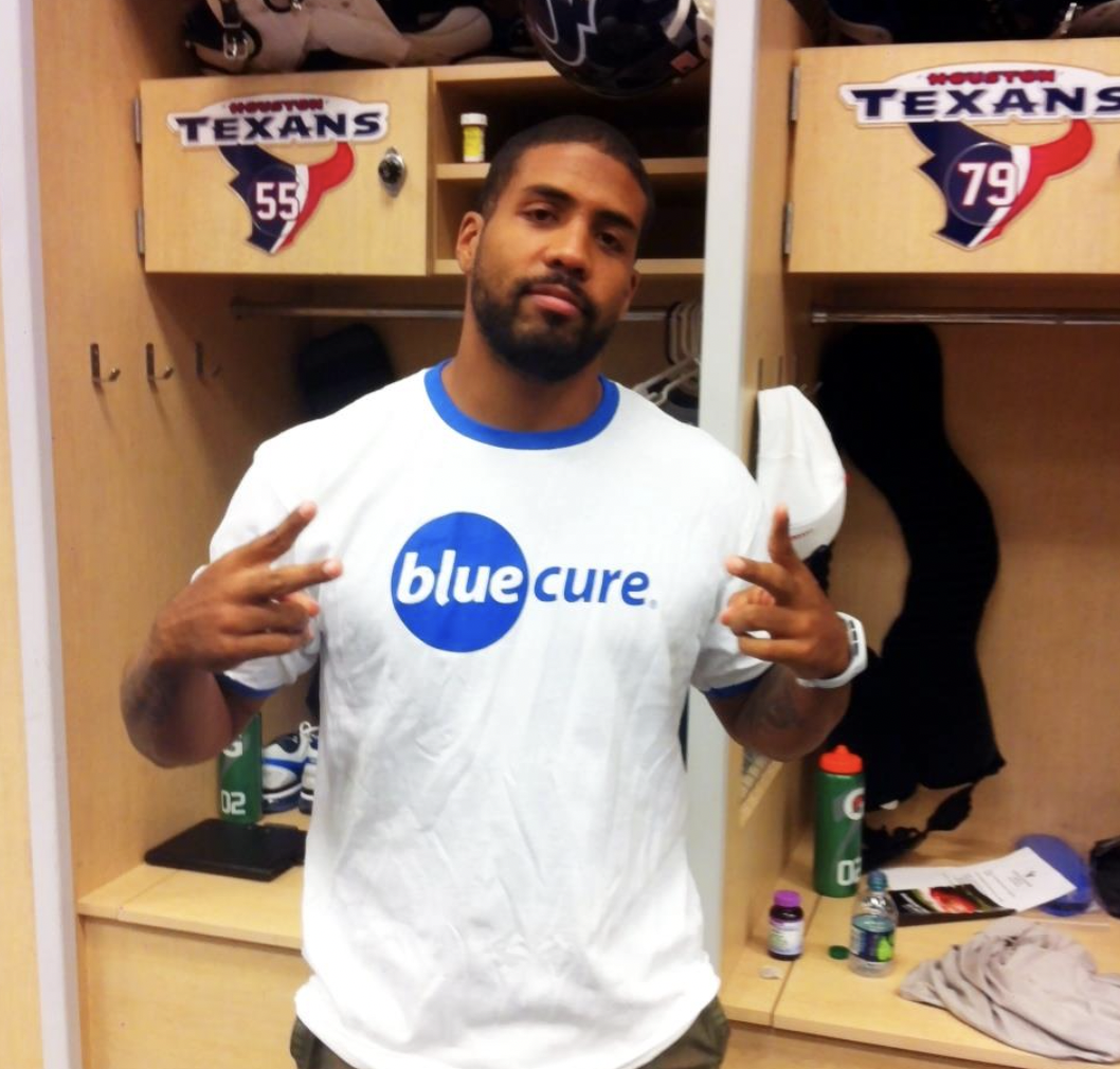 Arian Foster in Blue Cure shirt