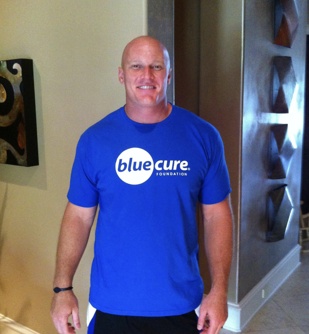 Chris Myers in Blue Cure shirt